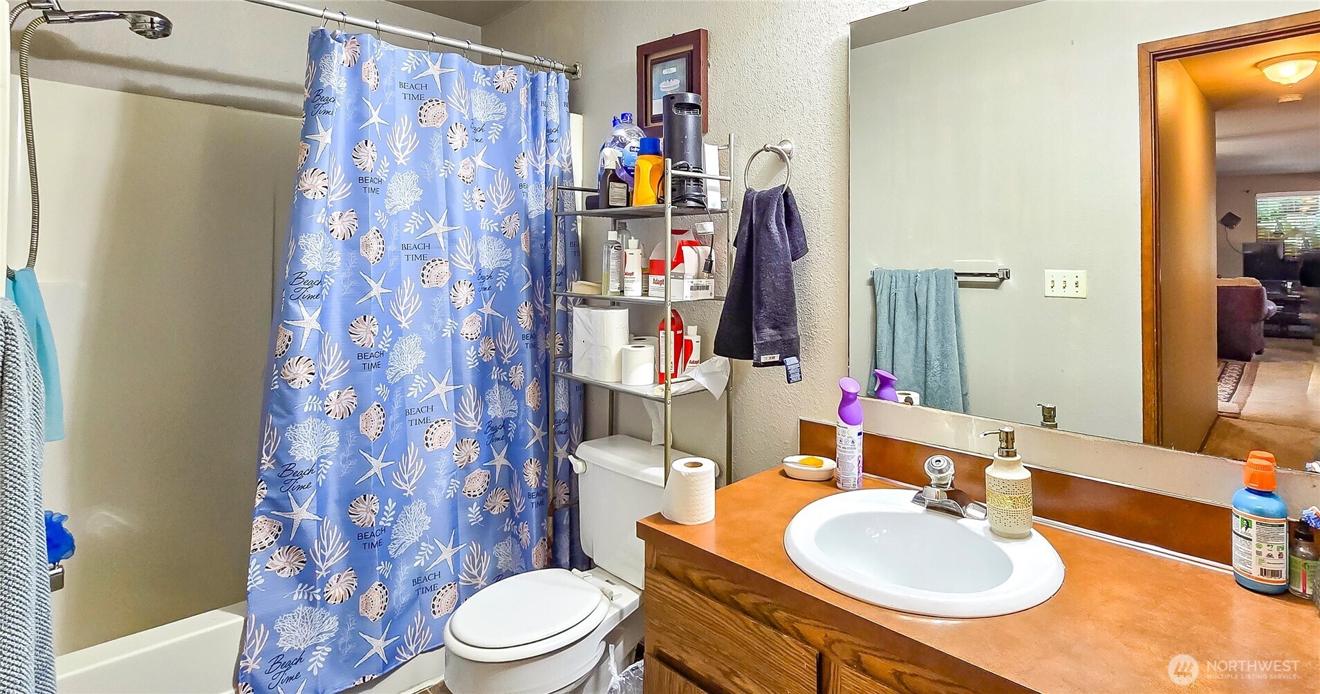 15609 8th Avenue Southwest Burien, WA 98166 - Photo 19 of 26 a bathroom with a sink toilet and shower