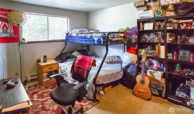 a living room with lots of furniture and a gym equipment