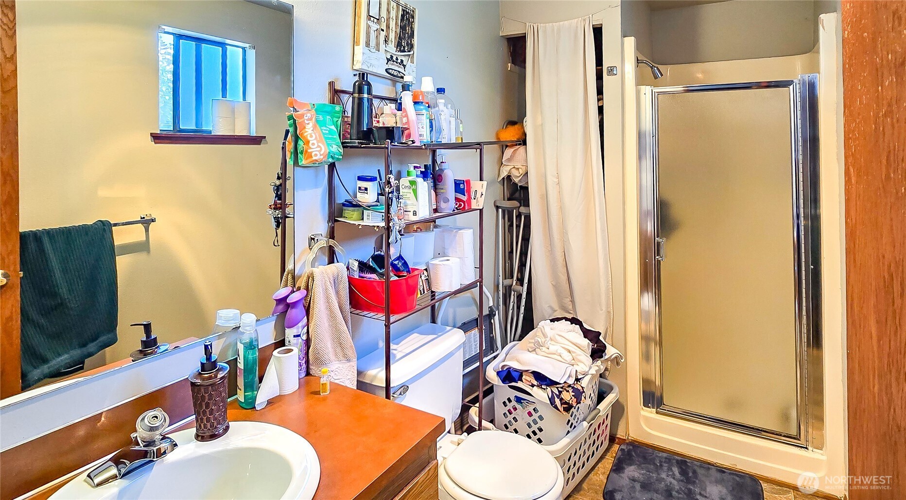 15609 8th Avenue Southwest Burien, WA 98166 - Photo 22 of 26 a living room with furniture and a flat screen tv