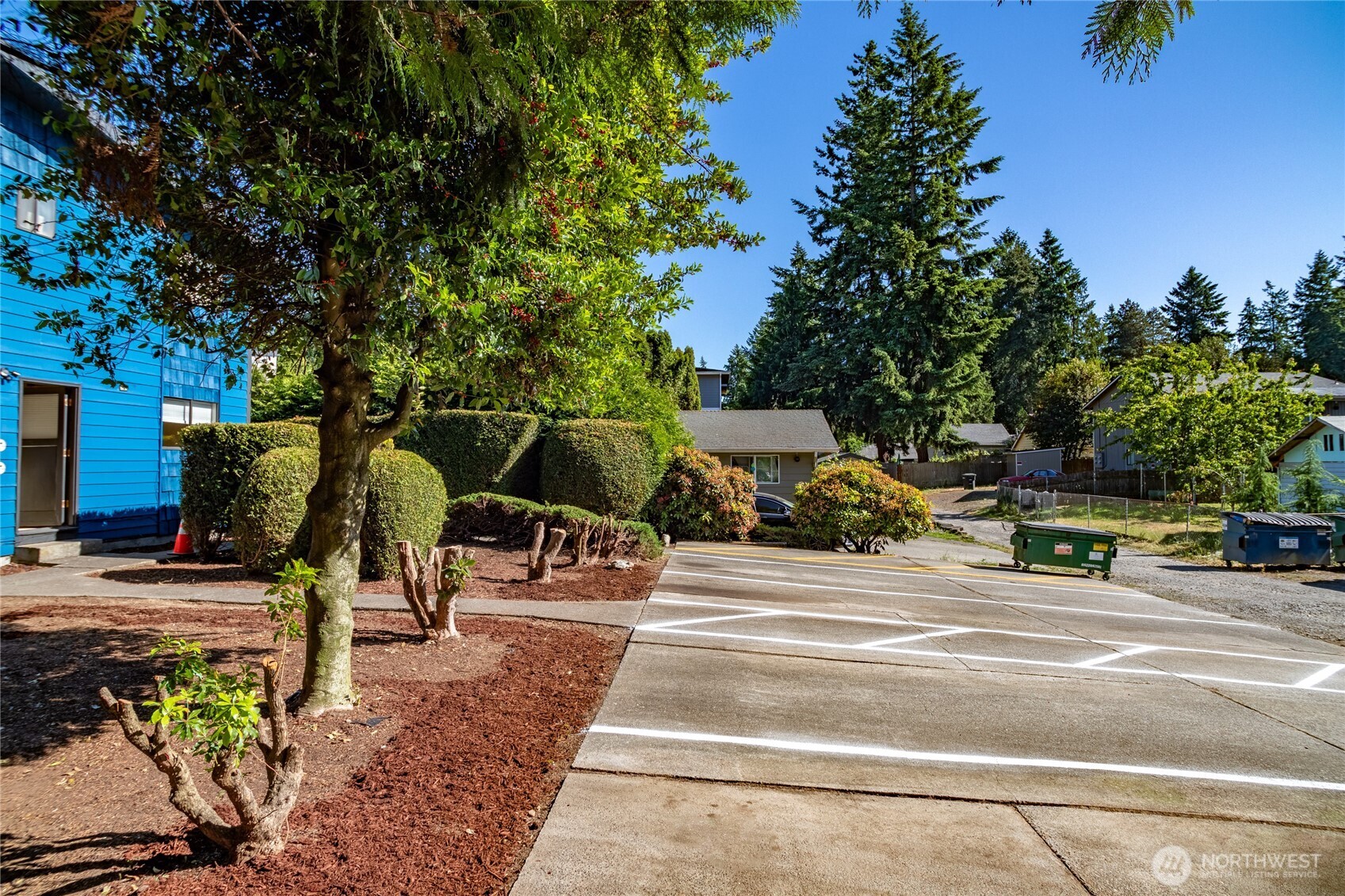 15609 8th Avenue Southwest Burien, WA 98166 - Photo 4 of 26 a view of a park with swings and slides