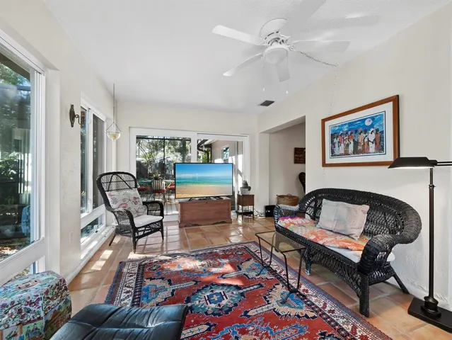 a living room with furniture and a window