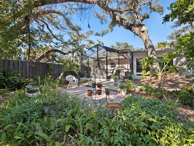 a view of a chairs in a backyard