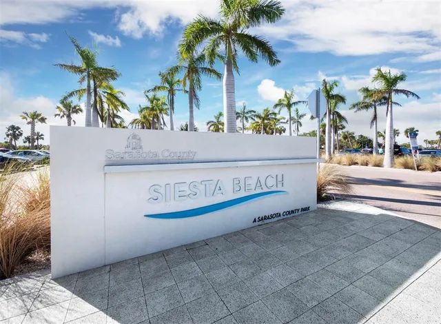 a sign that is on a brick wall