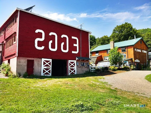 a sign broad in front of a brick building