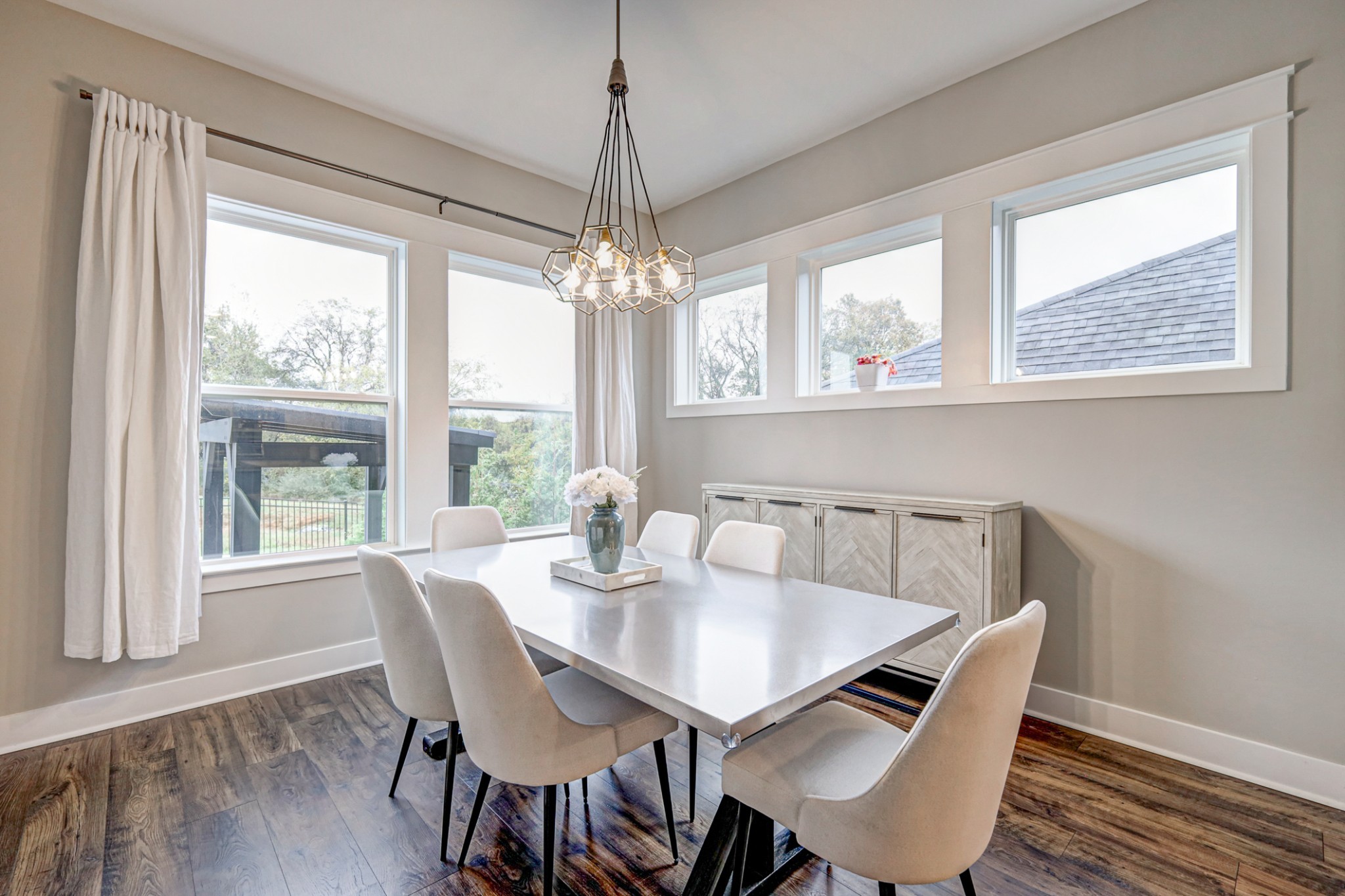 7748 Thayer Road Nolensville, TN 37135 - Photo 11 of 41 a view of a dining room with furniture wooden floor and chandelier