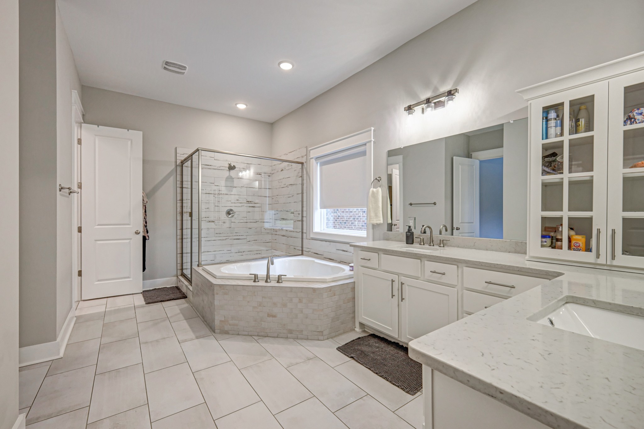 7748 Thayer Road Nolensville, TN 37135 - Photo 14 of 41 a spacious bathroom with a tub sink shower and mirror