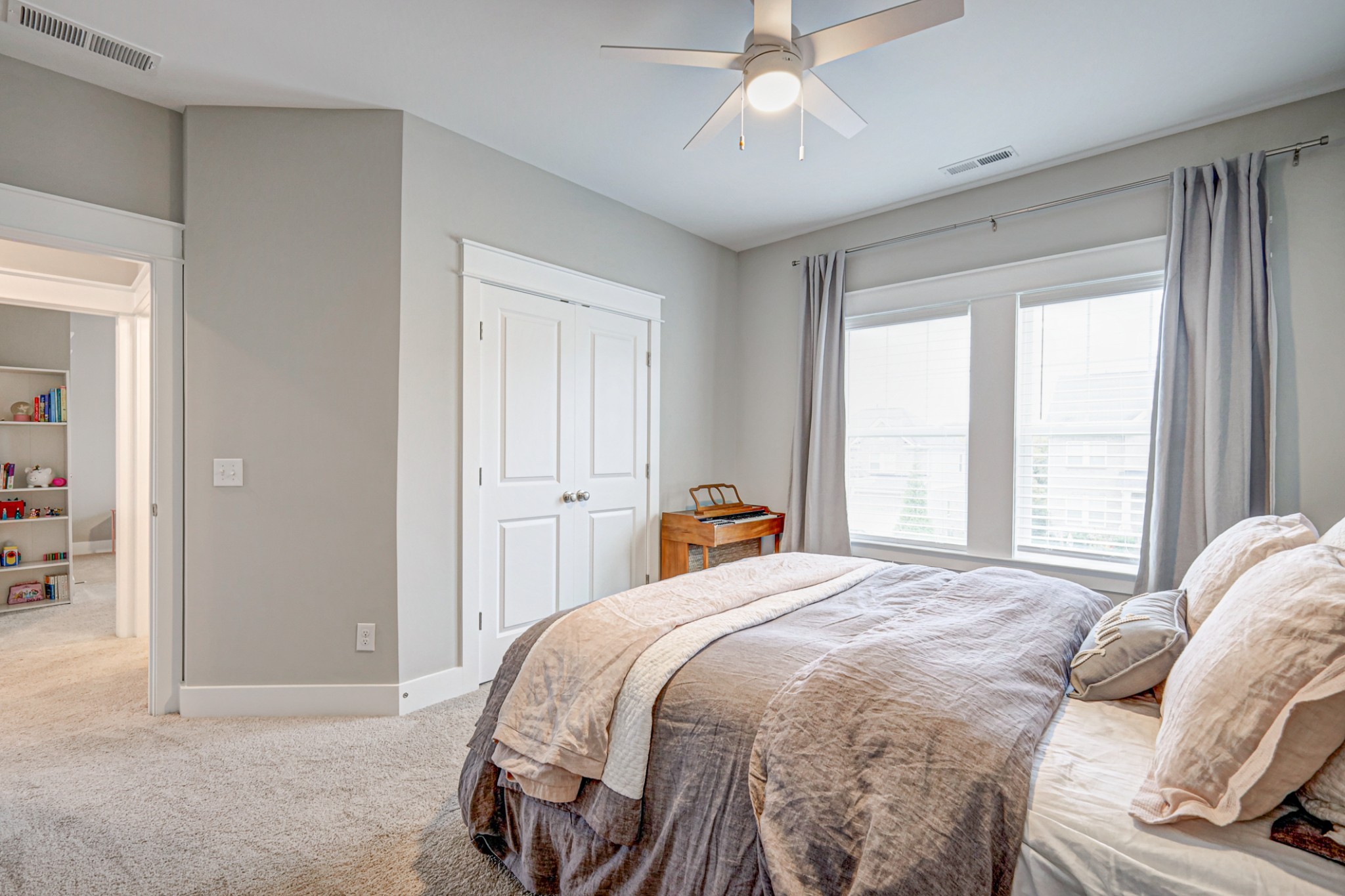 7748 Thayer Road Nolensville, TN 37135 - Photo 29 of 41 a bedroom with a bed and a chandelier