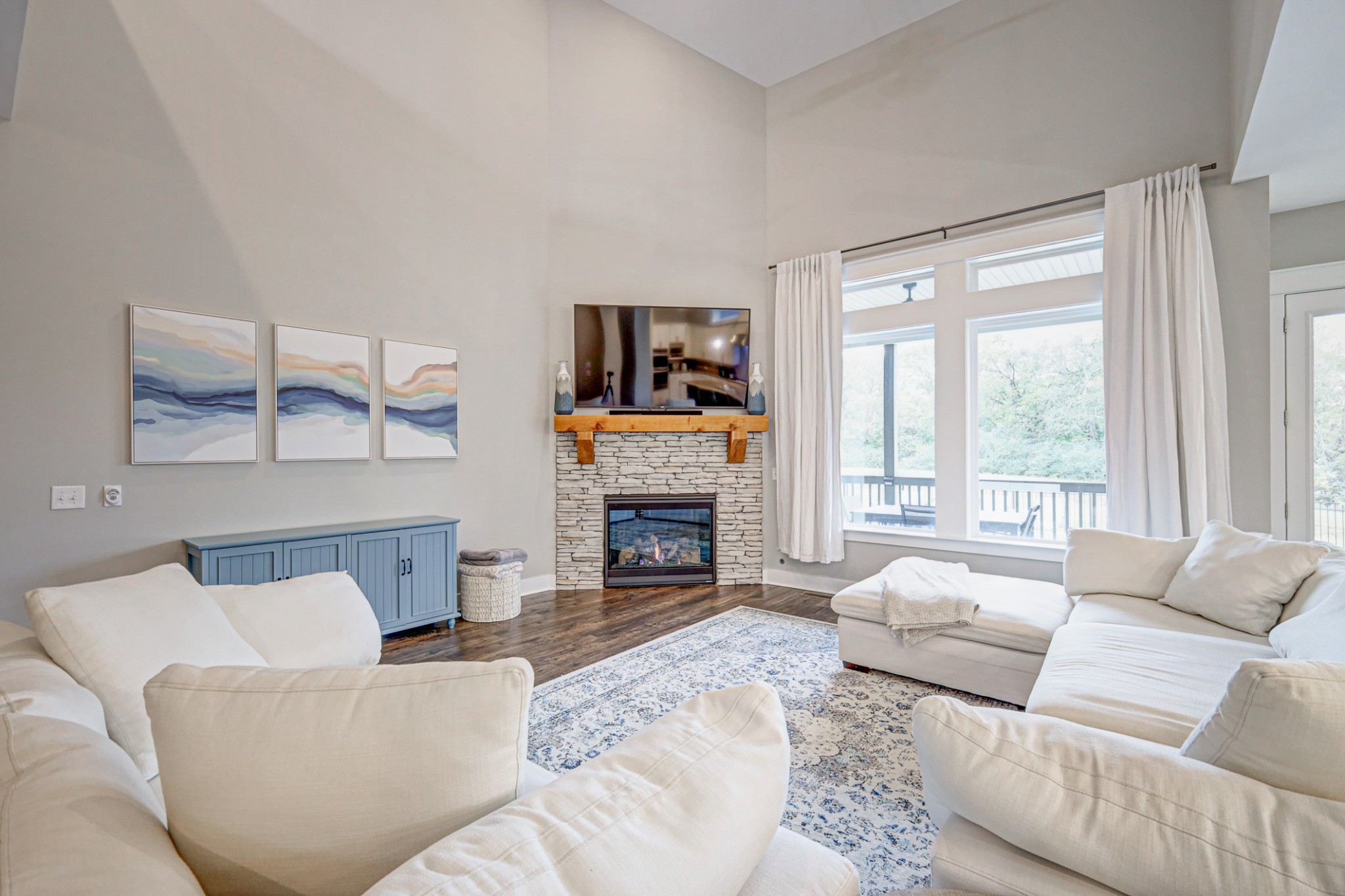 7748 Thayer Road Nolensville, TN 37135 - Photo 8 of 41 a living room with furniture a fireplace and a large window