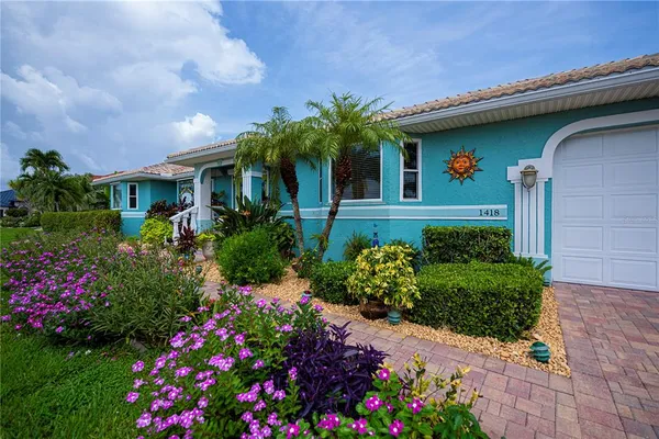 a view of water with boats and trees in the background
