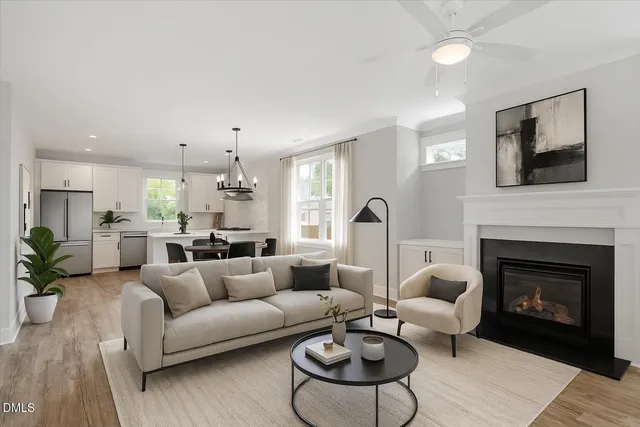 a living room with furniture fireplace and window