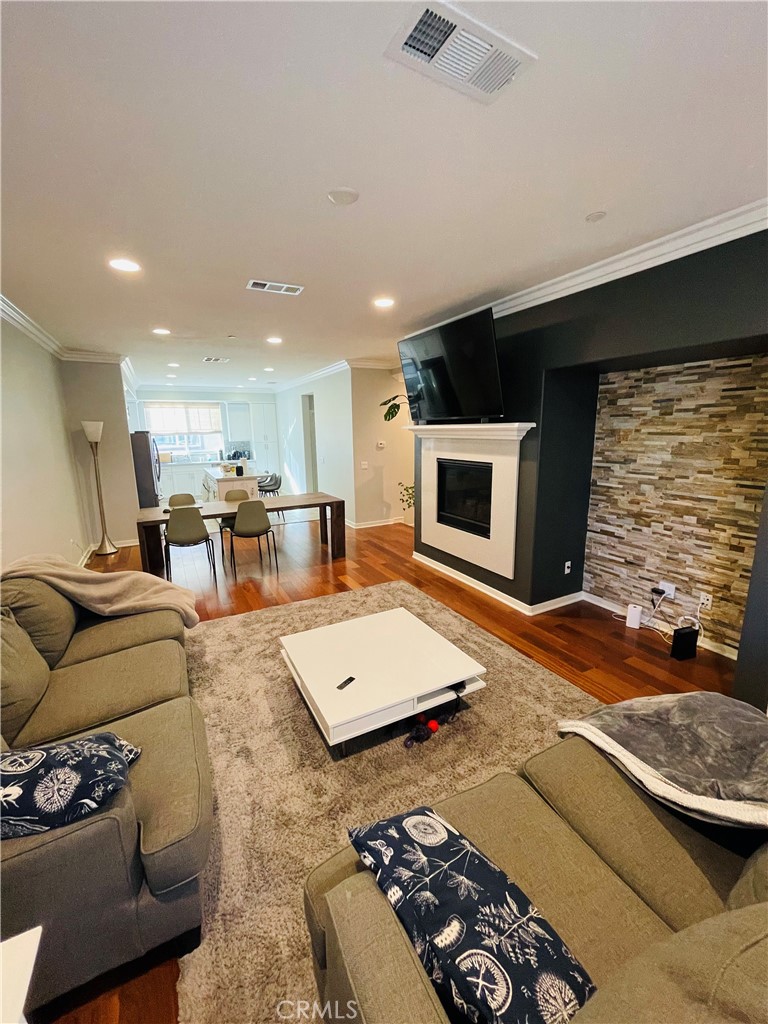713 South Azusa Avenue, Unit D Azusa, CA 91702 - Photo 13 of 33 a living room with furniture and a flat screen tv