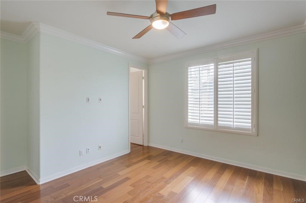 713 South Azusa Avenue, Unit D Azusa, CA 91702 - Photo 19 of 33 a view of an empty room with wooden floor and a window