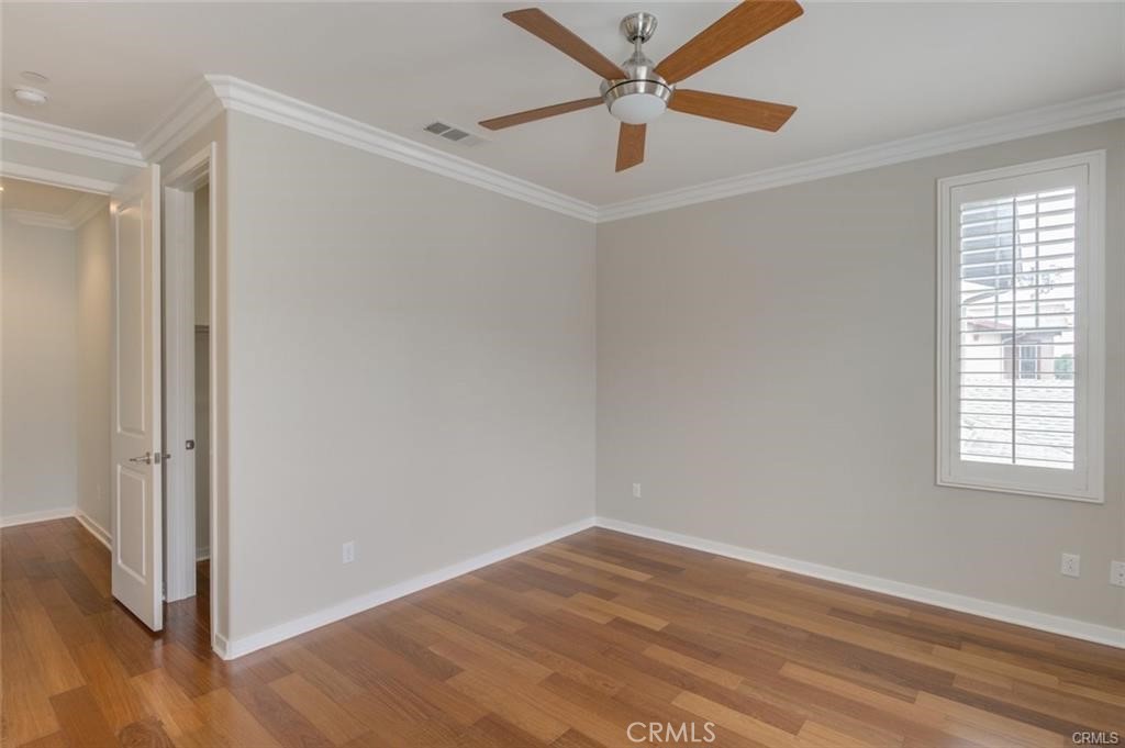 713 South Azusa Avenue, Unit D Azusa, CA 91702 - Photo 27 of 33 an empty room with wooden floor and windows