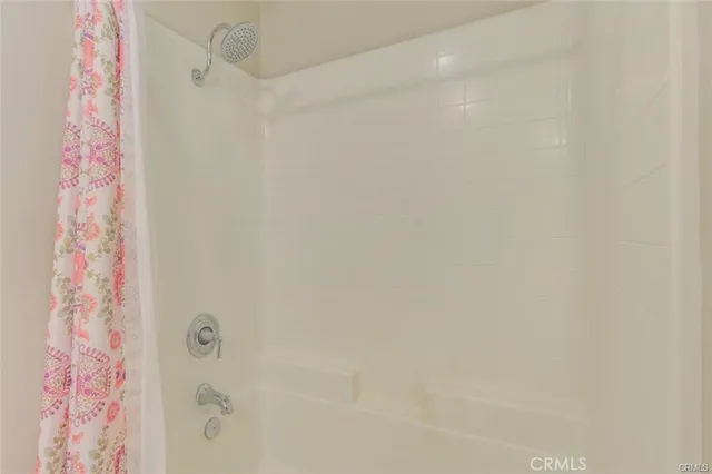 a bathroom with a shower curtain
