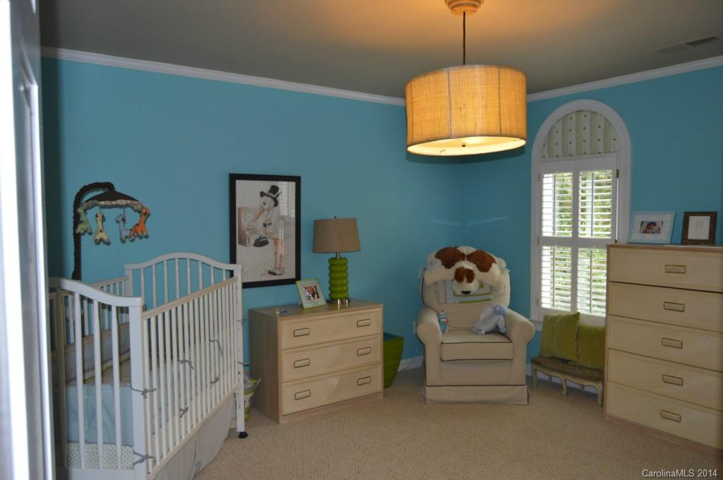 4618 Binfords Ridge Road Charlotte, NC 28226 - Photo 14 of 24 a bedroom with a bed and a window