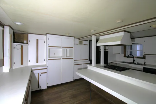 a kitchen with a refrigerator and a sink