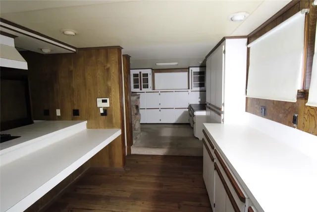 a spacious bathroom with a tub and shower