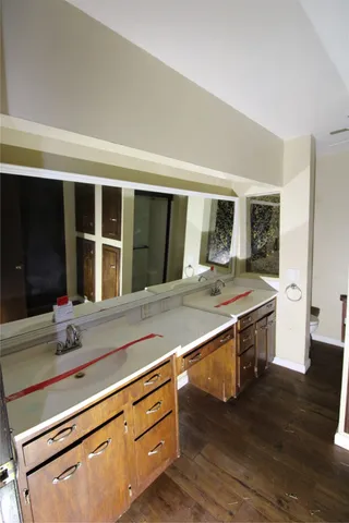 a view of kitchen with granite countertop window and sink
