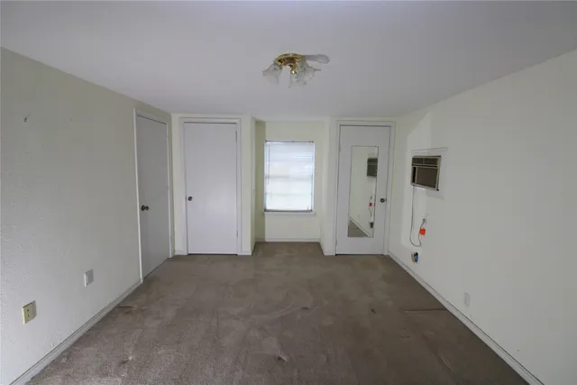 an empty room with a fireplace