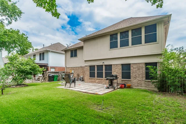 a group of people sitting in front of a house
