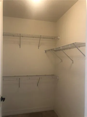 a view of a room with racks on the wall