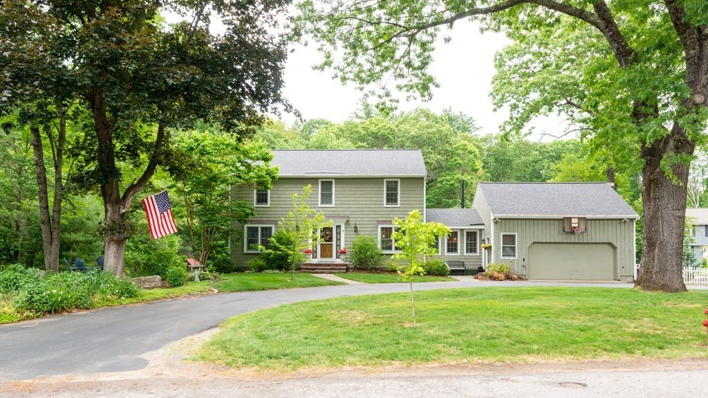 9 Parish Road Georgetown, MA 01833 - Photo 1 of 42 a front view of a house with a yard and a tree