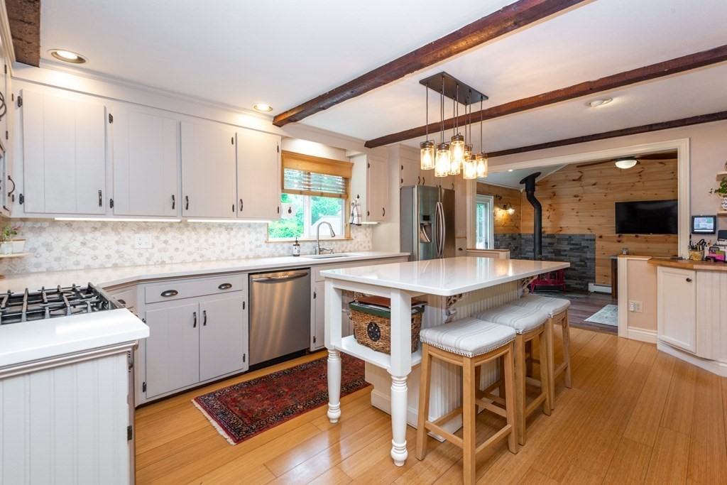 9 Parish Road Georgetown, MA 01833 - Photo 13 of 42 a kitchen with a sink cabinets and wooden floor