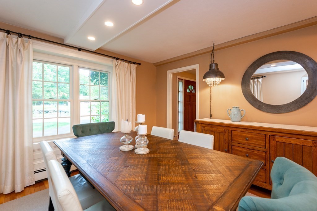 9 Parish Road Georgetown, MA 01833 - Photo 15 of 42 a living room with dining table and wooden floor