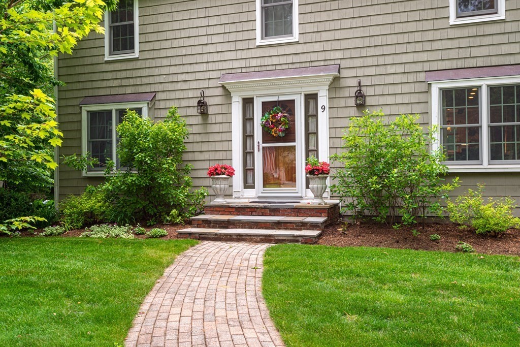 9 Parish Road Georgetown, MA 01833 - Photo 2 of 42 a front view of a house with a yard