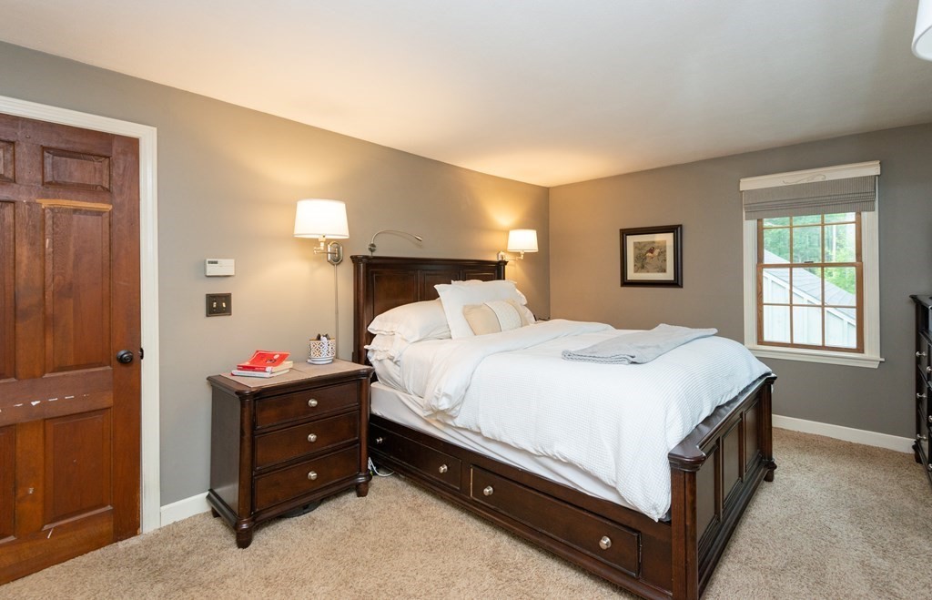 9 Parish Road Georgetown, MA 01833 - Photo 23 of 42 a bed room with a bed and a dresser