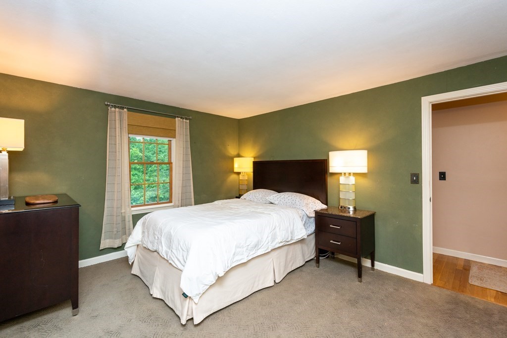 9 Parish Road Georgetown, MA 01833 - Photo 25 of 42 a bedroom with a bed lamp and a dresser
