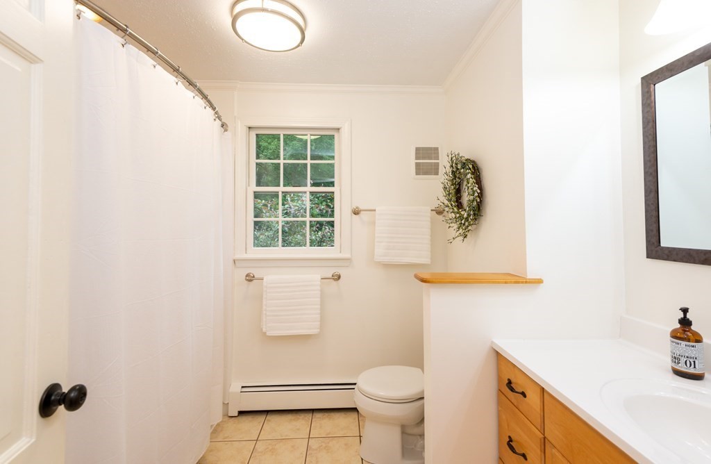 9 Parish Road Georgetown, MA 01833 - Photo 29 of 42 a bathroom with a sink toilet and a mirror