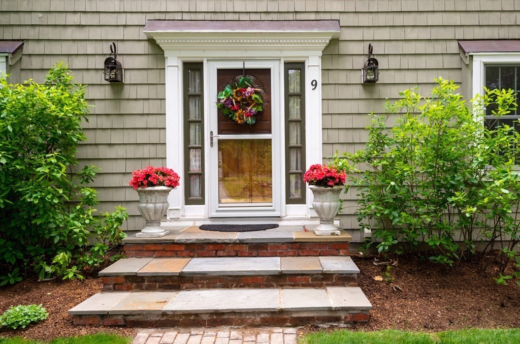 9 Parish Road Georgetown, MA 01833 - Photo 3 of 42 a front view of a house with a porch