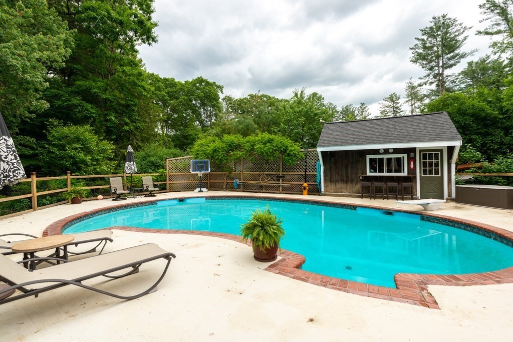 9 Parish Road Georgetown, MA 01833 - Photo 37 of 42 a view of a house with a swimming pool and sitting area