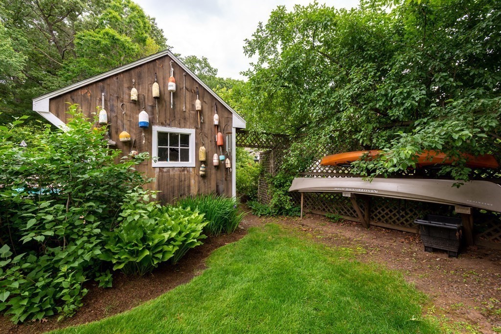 9 Parish Road Georgetown, MA 01833 - Photo 40 of 42 a front view of a house with a yard and sitting area