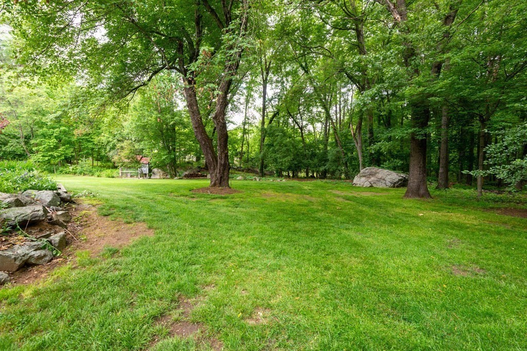 9 Parish Road Georgetown, MA 01833 - Photo 42 of 42 a view of a grassy field with trees in the background