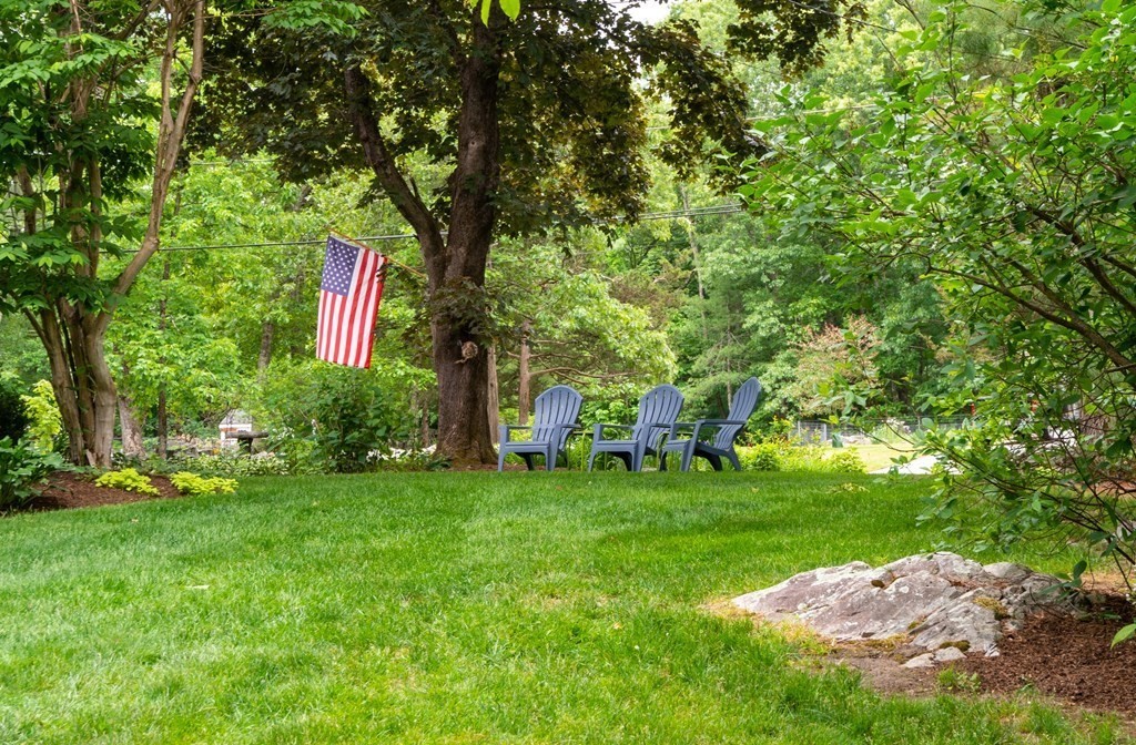 9 Parish Road Georgetown, MA 01833 - Photo 5 of 42 a backyard of a house with table and chairs