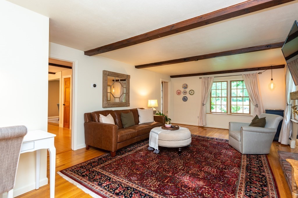 9 Parish Road Georgetown, MA 01833 - Photo 9 of 42 a living room with furniture and a rug