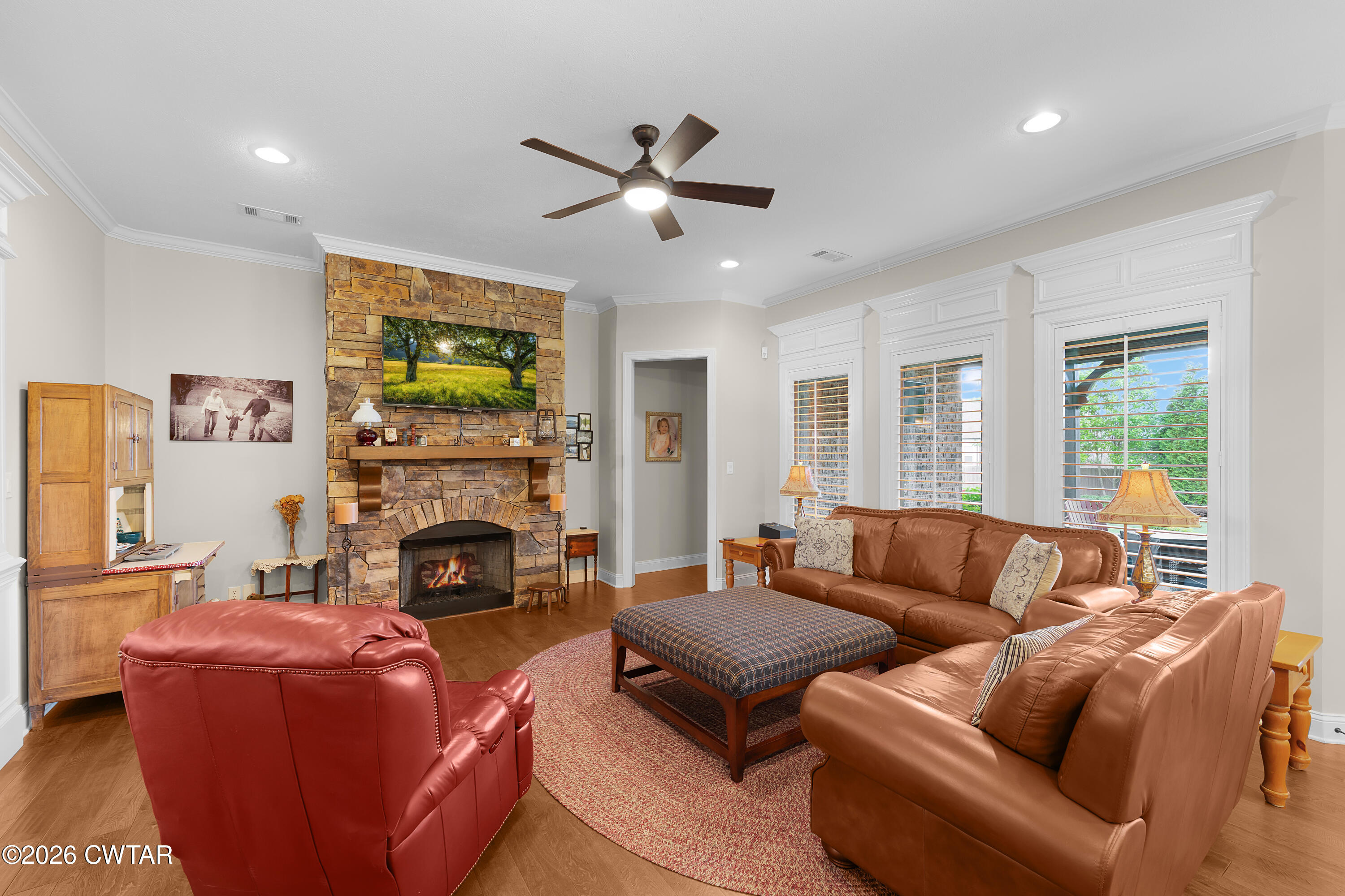 34 Cheddleton Cove Jackson, TN 38305 - Photo 8 of 32 a living room with furniture fireplace and a large window