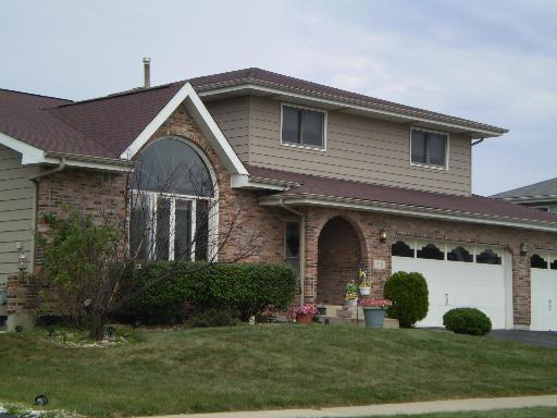 310 Highland Road Matteson, IL 60443 - Photo 1 of 1 a front view of a house with garden