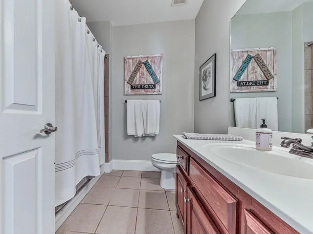 a view of a house with backyard and porch