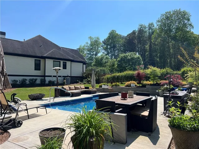 an aerial view of house with yard