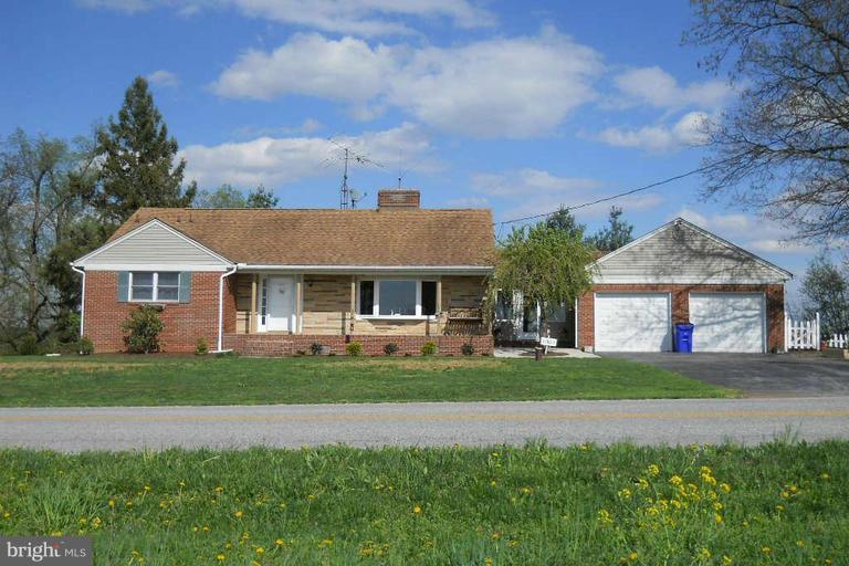 11823 Houck Road Union Bridge, MD 21791 - Photo 1 of 30 a front view of a house with a yard and garage