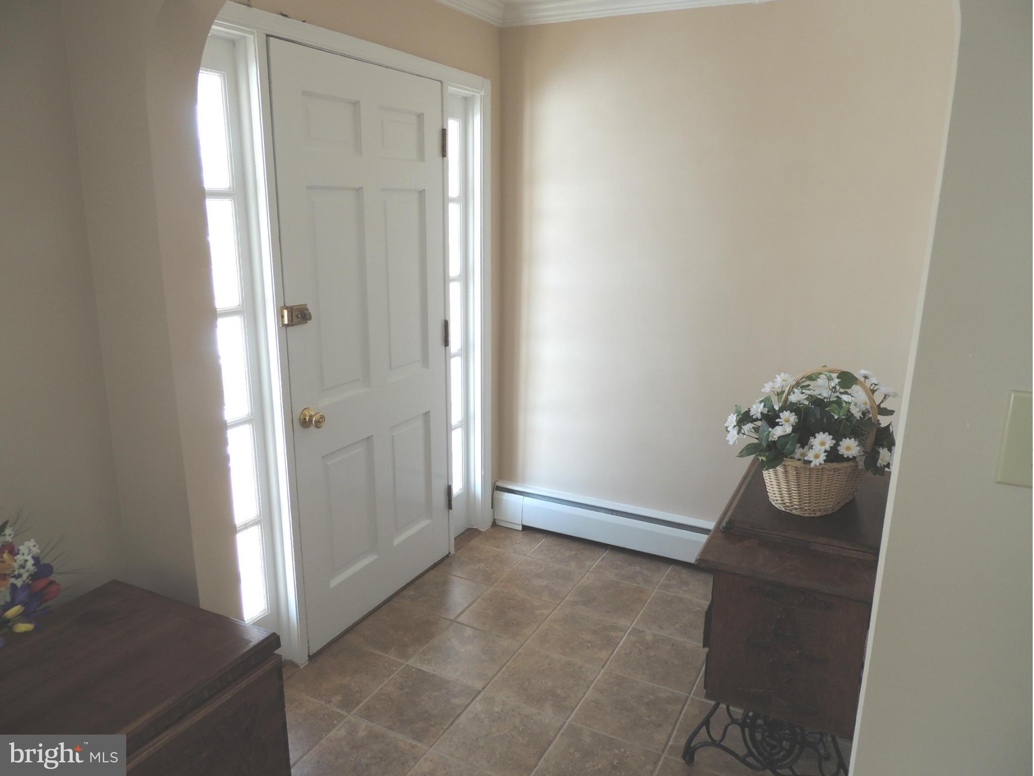11823 Houck Road Union Bridge, MD 21791 - Photo 9 of 30 an empty room with wooden floor and mirror