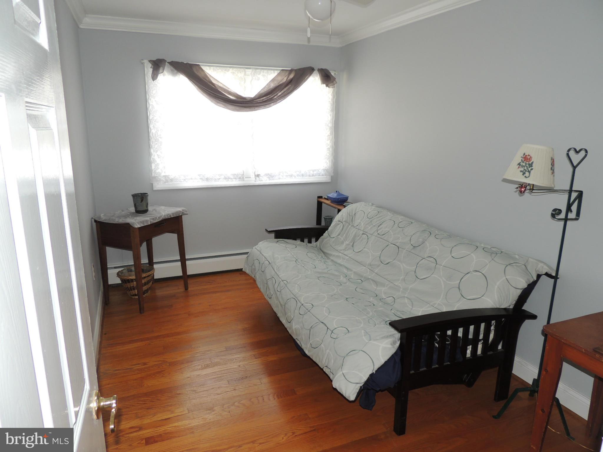 11823 Houck Road Union Bridge, MD 21791 - Photo 10 of 30 a bedroom with a bed and a window