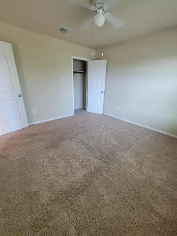 a view of a livingroom with a ceiling fan