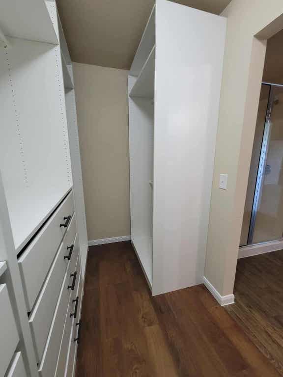 213 Camellia Drive Hutto, TX 78634 - Photo 23 of 27 a view of an empty room with wooden floor and a window