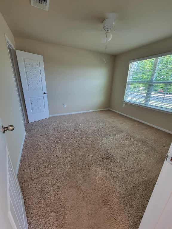 213 Camellia Drive Hutto, TX 78634 - Photo 4 of 27 an empty room with windows