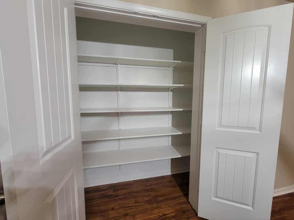 213 Camellia Drive Hutto, TX 78634 - Photo 6 of 27 a view of walk in closet with empty racks