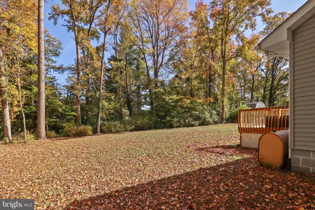 a backyard of a house with outdoor seating